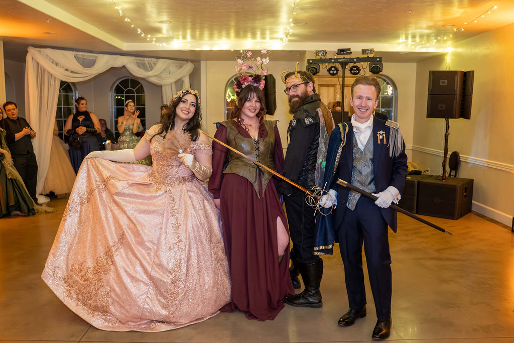 Guests gathered in the ballroom, one in a grand pink gown